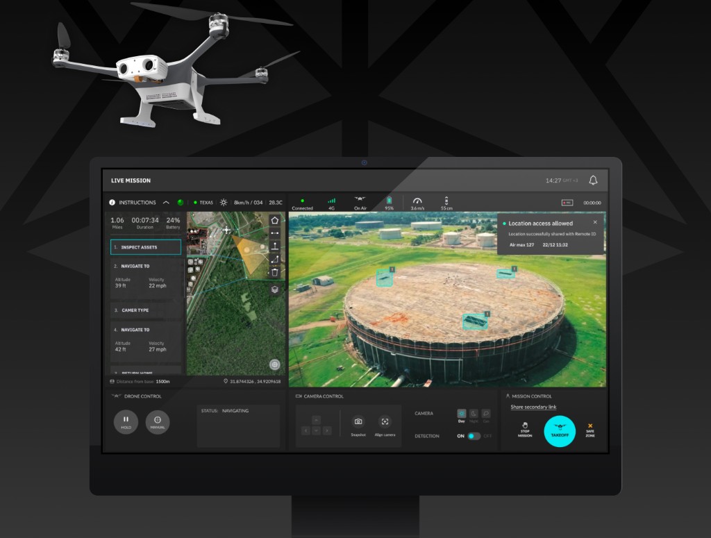 Industrial inspection drone above a monitor showing the AIM live mission dashboard, aerial tank view with detection overlays, and Remote ID location confirmation